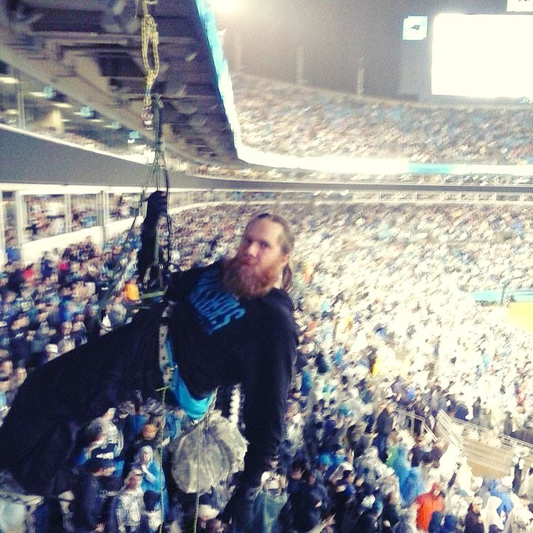 Pennsylvania activist, John Nicholson, rappelling during Monday Night Football for a banner drop that protested Bank of America's financial support of Dominion Energy construction of the Cove Point LNG facility in Lusby, Maryland. Photo: WeAreCovePoint.org/ provided to Public Herald